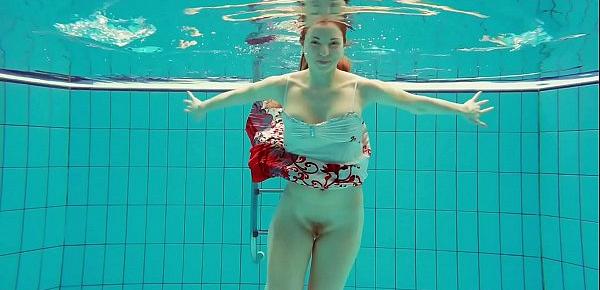  Hot Polish redhead swimming in the pool